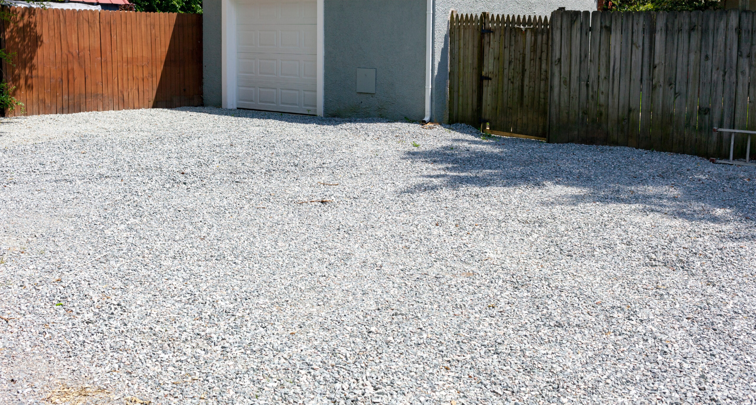 New gravel driveway in rear of residential home.