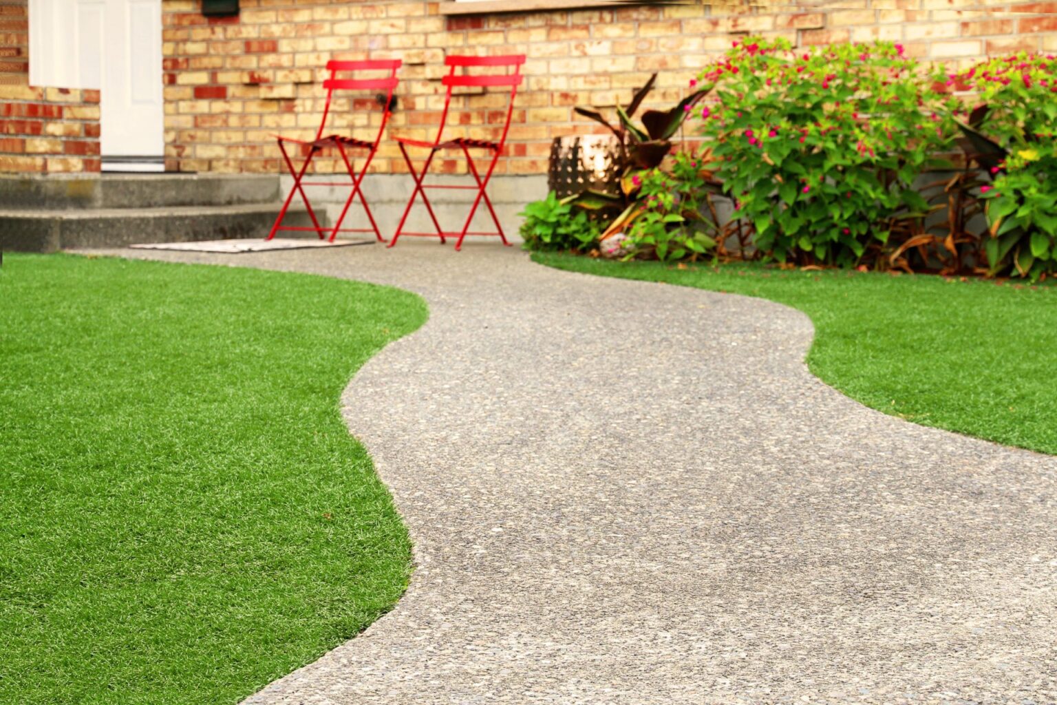 pathway curved through artificial grass
